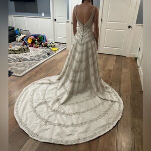 Size 4 Vintage weddings dress with train sequines and beading.